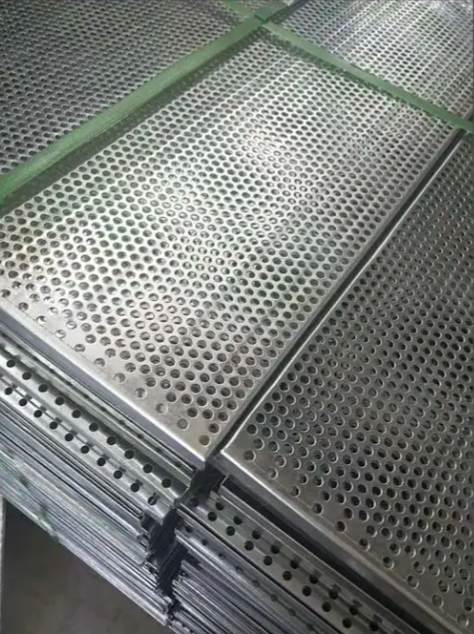 Architectural perforated wire mesh panel installation on building façade